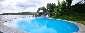 Bazén v ubytování Du Lịch Lâm Hà - Hồ Gia Trang Villas nebo v jeho okolí