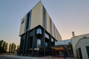 an office building with a large building at RMH Modena Raffaello in Modena