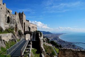 a castle on a hill with a view of the ocean at La Isla Resort in Pontecagnano