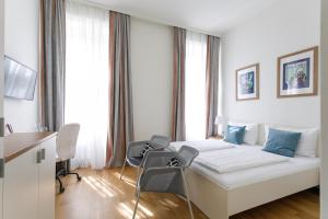 Postel nebo postele na pokoji v ubytování Riess City Rooms - Self Check-in