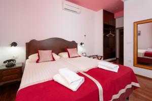 Voodi või voodid majutusasutuse Heritage Hotel Tragos toas