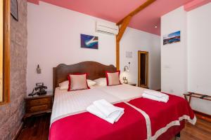 Voodi või voodid majutusasutuse Heritage Hotel Tragos toas