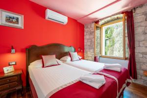 Voodi või voodid majutusasutuse Heritage Hotel Tragos toas