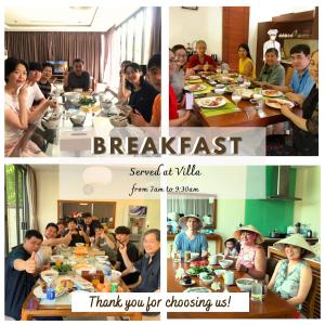 un grupo de personas sentadas alrededor de una mesa comiendo comida en Da Nang Paradise Center My Khe Beach Resort & Spa en Da Nang