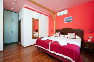 Voodi või voodid majutusasutuse Heritage Hotel Tragos toas