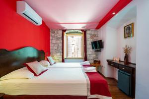 Voodi või voodid majutusasutuse Heritage Hotel Tragos toas