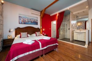 Voodi või voodid majutusasutuse Heritage Hotel Tragos toas