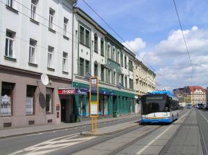 a bus is parked on the side of a street at Hostel Moravia Ostrava in Ostrava