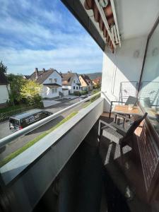 a balcony with a bench and a view of a street at KnocksCasa4you 2 Zimmer Monteure Appartement Nr 21 in Marburg in Marburg an der Lahn