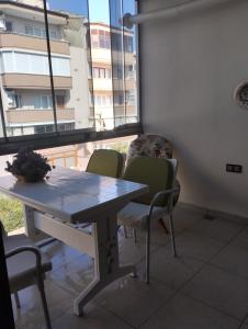 a table and chairs in a room with a window at تركيا 