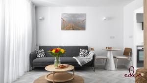 a living room with a couch and a bridge at דירה מעוצבת עם נוף מטריף לים במתחם סי סייד - Edomlux in Eilat +14 photos