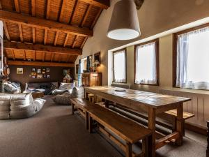 a living room with a wooden table and a couch at Chalet Val-d'Isère, 4 pièces, 8 personnes - FR-1-694-99 in Val-d'Isère