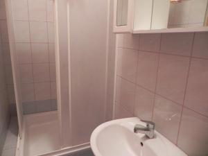 a bathroom with a sink and a shower at Apartments Riva in Pag +19 photos