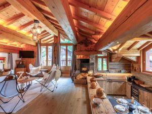 a log cabin living room with wooden ceilings and a fireplace at Appartement Val-d'Isère, 5 pièces, 8 personnes - FR-1-694-305 in Val-d'Isère