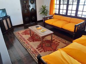 a living room with a couch and a table at Blue Bay Village in Watamu