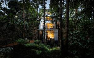 a tree house in the middle of the forest at The Estate Hulu Rening - Private Retreat Cabin in Batang Kali