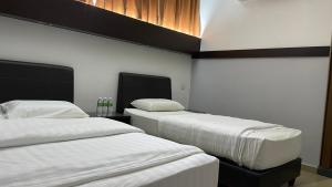 Postel nebo postele na pokoji v ubytování GOPENG INN