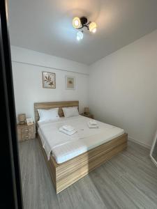 a bedroom with a bed and a ceiling fan at Cozy Studios in Suceava in Suceava