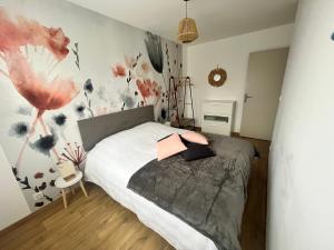 Ένα ή περισσότερα κρεβάτια σε δωμάτιο στο Maison 4/6 personnes à Bayeux