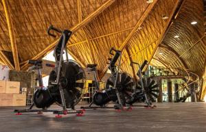 a group of exercise bikes parked in a building at Relax in Nature Villa Namu Lombok in Kuta Lombok