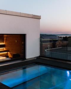 a swimming pool on the roof of a building at Sommerro in Oslo