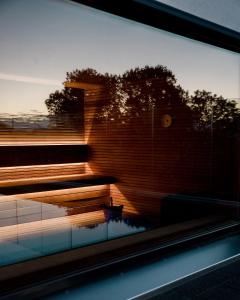 a view of a building with a reflection in a window at Sommerro in Oslo