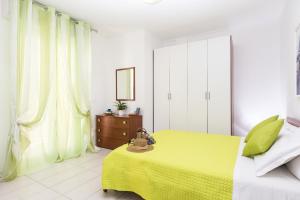 A bed or beds in a room at Green Residence