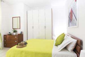 A bed or beds in a room at Green Residence