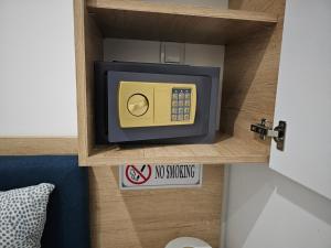 a toy microwave on a shelf in a room at Andjelka A26 in Veliko Gradište