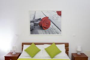 A bed or beds in a room at Green Residence