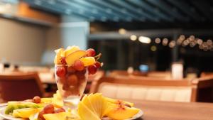 a vase filled with fruit on top of a table at Amber Palace Hotel in Istanbul