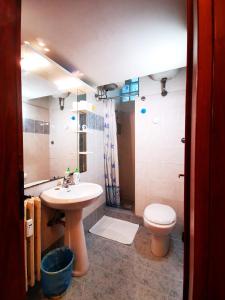 a bathroom with a sink and a toilet at Maestoso Appartamento Turistico in Rome