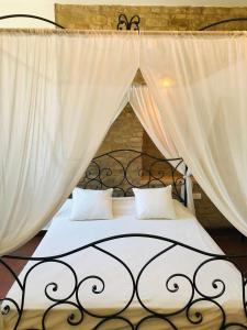 A bed or beds in a room at Villa San Marco - Homelike Villas