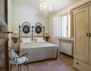 A bed or beds in a room at Villa San Marco - Homelike Villas