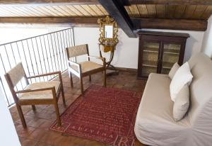 A seating area at Villa San Marco - Homelike Villas