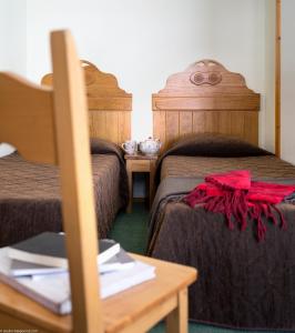 Postel nebo postele na pokoji v ubytování Le Cheval Blanc - Village Montana