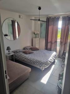 a bedroom with two beds and a mirror at Groupama stadium in Décines-Charpieu