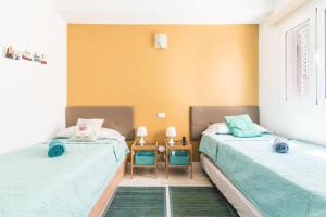 Giường trong phòng chung tại Casa Pizquito Agaete con piscina +34 ảnh