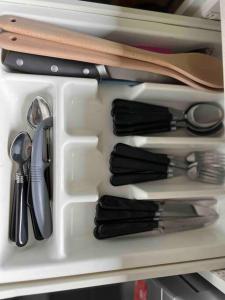a drawer filled with utensils in a refrigerator at Wetland Gem in Wonthaggi