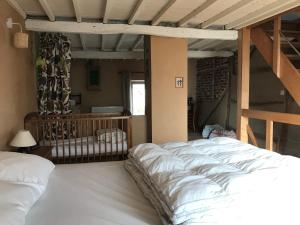 Postel nebo postele na pokoji v ubytování « Le LoMa » Ancienne fermette