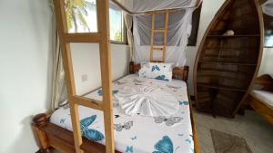 a bedroom with a bunk bed with a ladder at Aquarium Beach House in Nungwi +54 photos