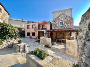 a large stone building with a patio in front of it at Holiday home in Bribir 41512 in Bribir