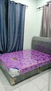 Giường trong phòng chung tại SP 1 Homestay Kuranji Kota Marudu Sabah +2 ảnh