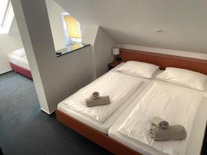 Postel nebo postele na pokoji v ubytování Hotel am Malerwinkel