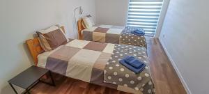a bedroom with two twin beds and a wooden floor at Apartment 3 in Altstadt in Angermünde in Angermünde