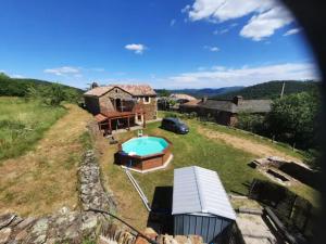 an aerial view of a house with a swimming pool at Gite Des Retrouvailles in Malbosc