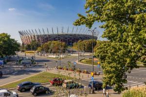 a parking lot in front of a soccer stadium at Apartment in the Centre of Warsaw by Renters in Warsaw