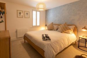 a bedroom with a bed and a blue wall at Regency Court in Southampton