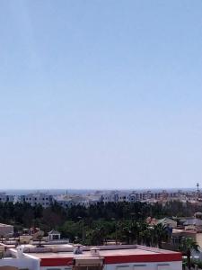 a view of a city with buildings and a blue sky at Flat Al farabi in Agadir