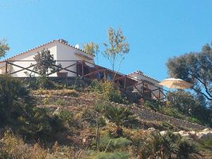 a house sitting on top of a hill at B&B Tre Giummare in Scopello
